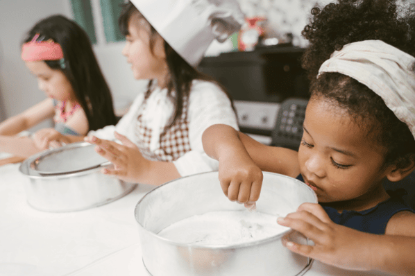 Children learning how to bake.