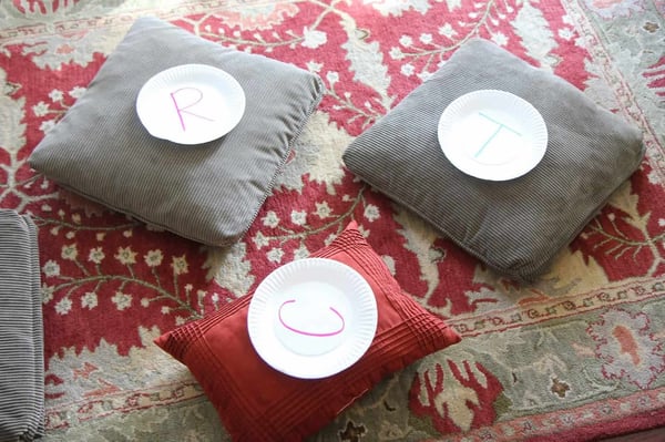 three pillows with alphabet letters on top 