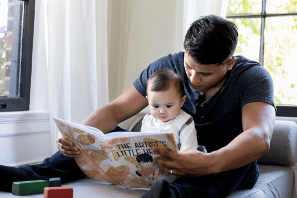 Man reading to baby.