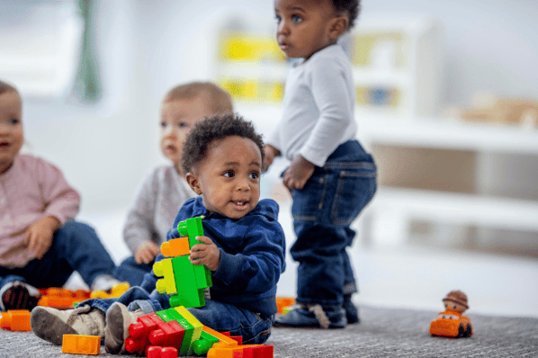 Toddlers playing with blocks at daycare.