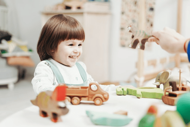 young child having fun with toys
