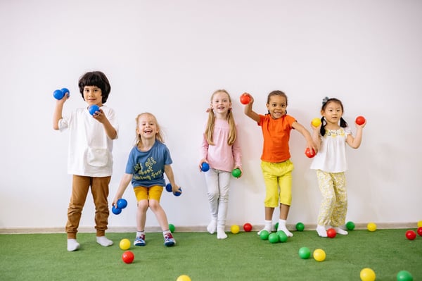 children throwing balls 